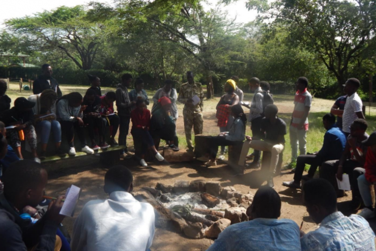 Students conducting a key informant interview in Oldonyo Sabuk National Park with KWS officer.