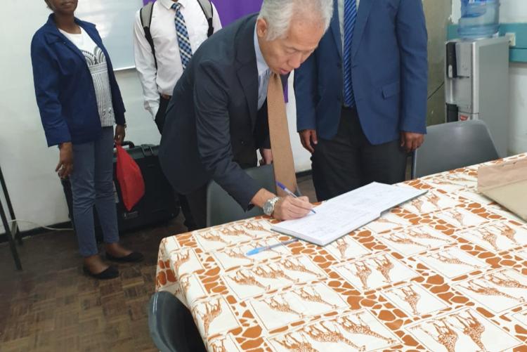 Mr. Akifumu Watanabe of KOEI-Africa Signs the Visitors Book in Department of Urban and Regional Planning