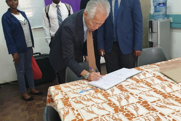 Mr. Akifumu Watanabe of KOEI-Africa Signs the Visitors Book 