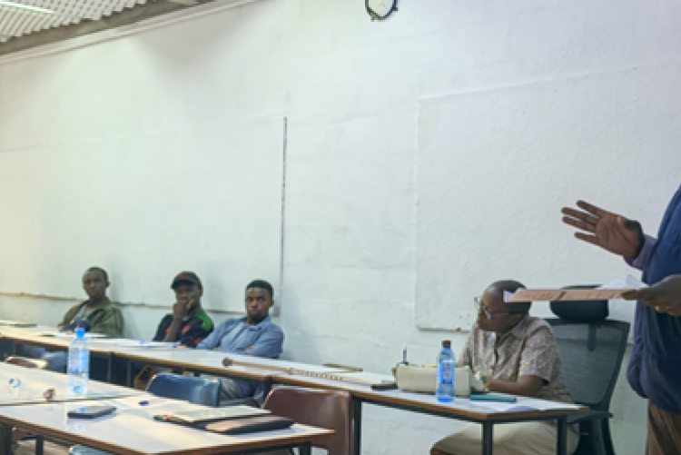 Dr Romanus O. Opiyo discussing their point during plenary discussions of the Talk in Photos 