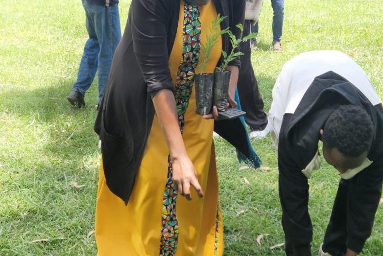 Planner Helen Nzainga during tree planting session